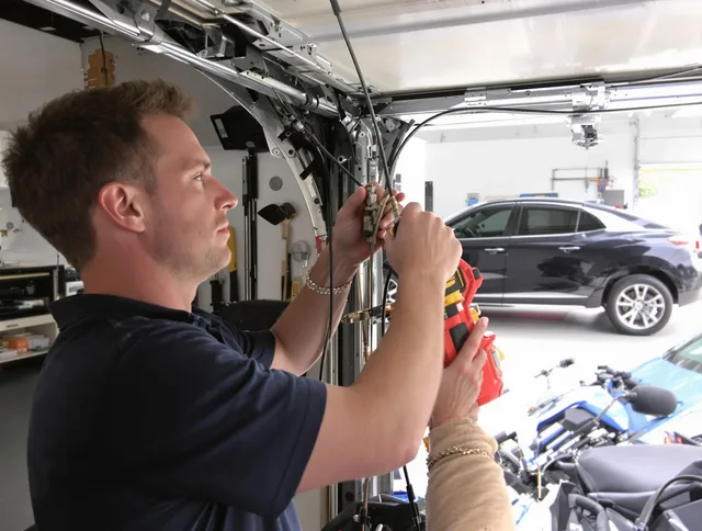 Coventry Garage Door Repair safety certified technician performing cable replacement in Coventry