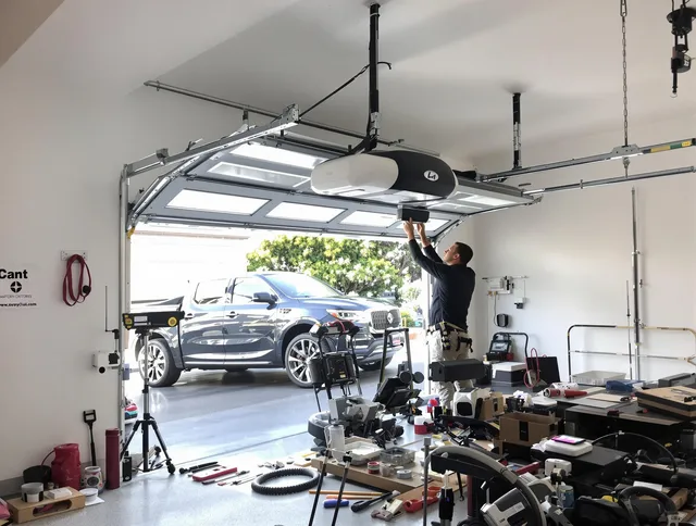 Coventry Garage Door Repair specialist installing smart garage door opener system in Coventry home