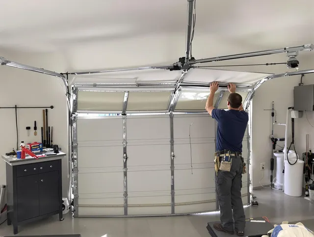Coventry Garage Door Repair specialist performing precise section replacement on Coventry garage door